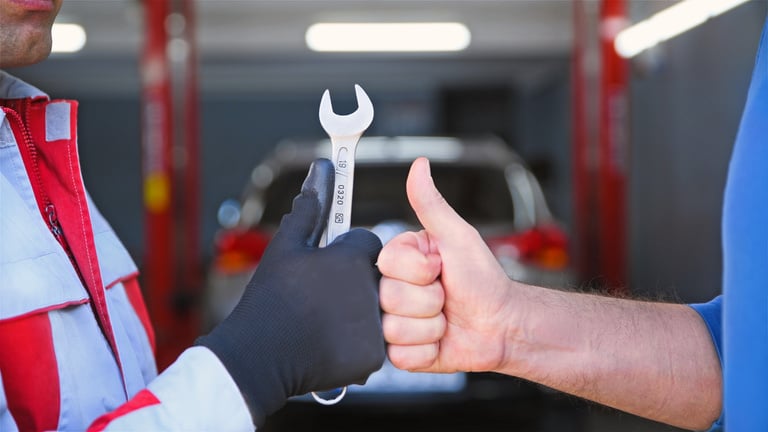 Auto Mechanic and Customer Like Button in Auto Repair Shop