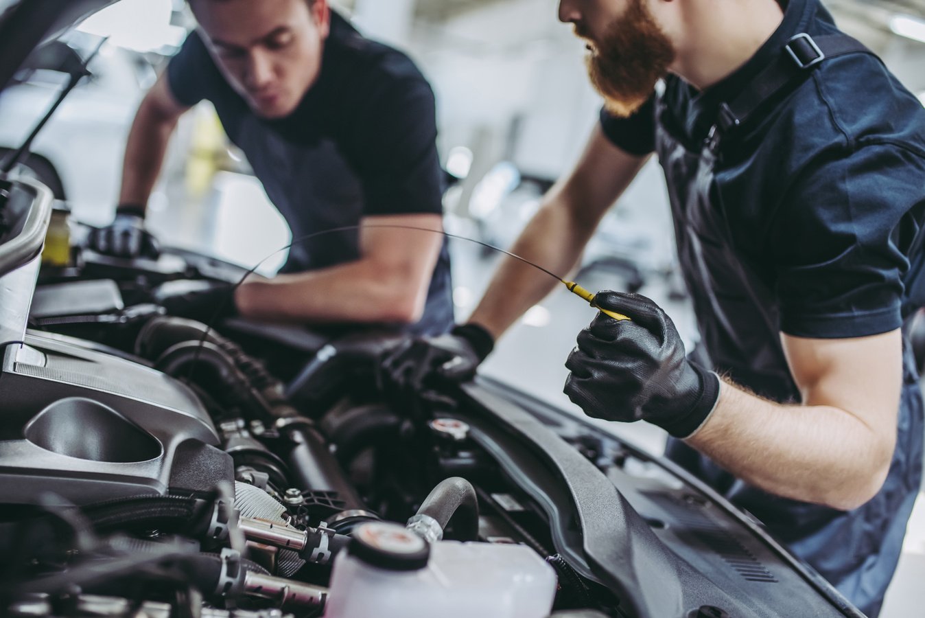 Handsome auto service mechanics.